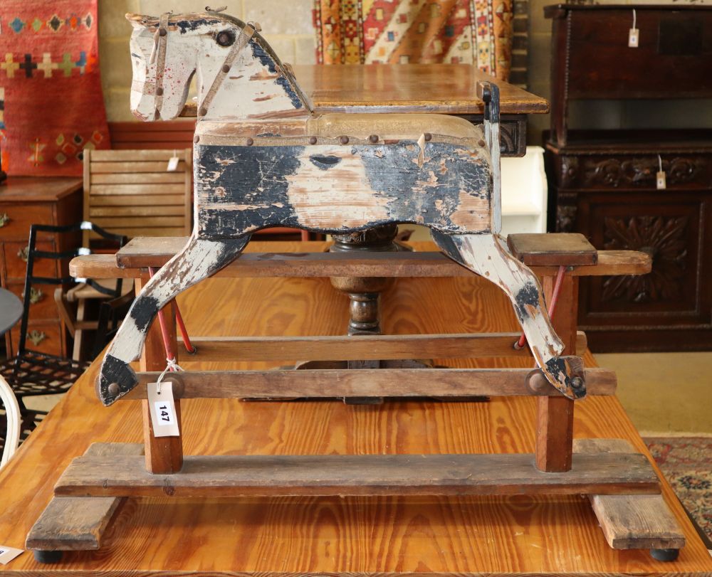 An early 20th century naive wood rocking horse, L.82cm, H.69cm